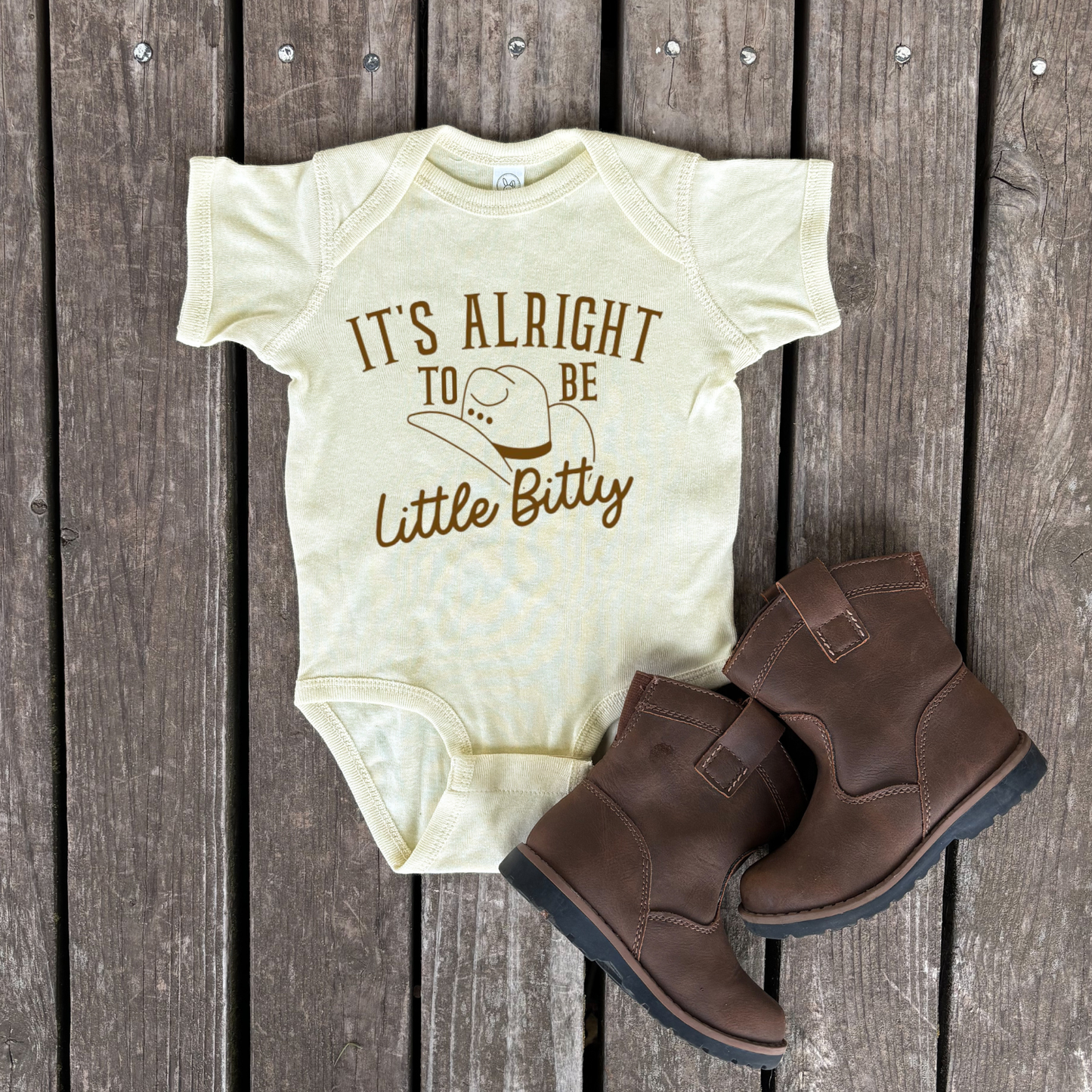 It's Alright To Be Little Bitty Infant Bodysuit | Brown